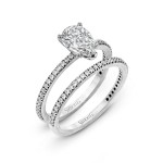 PEAR-CUT ENGAGEMENT RING & MATCHING WEDDING BAND IN PLATINUM WITH DIAMONDS