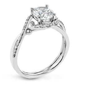 ROUND-CUT CRISS-CROSS ENGAGEMENT RING IN PLATINUM WITH DIAMONDS