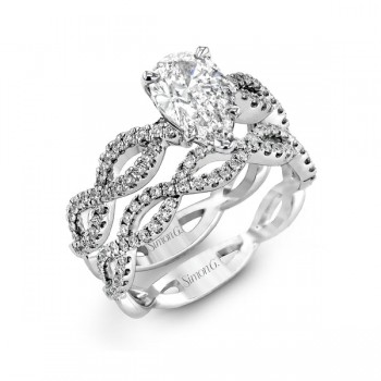 PEAR-CUT CRISS-CROSS ENGAGEMENT RING & MATCHING WEDDING BAND IN PLATINUM WITH DIAMONDS